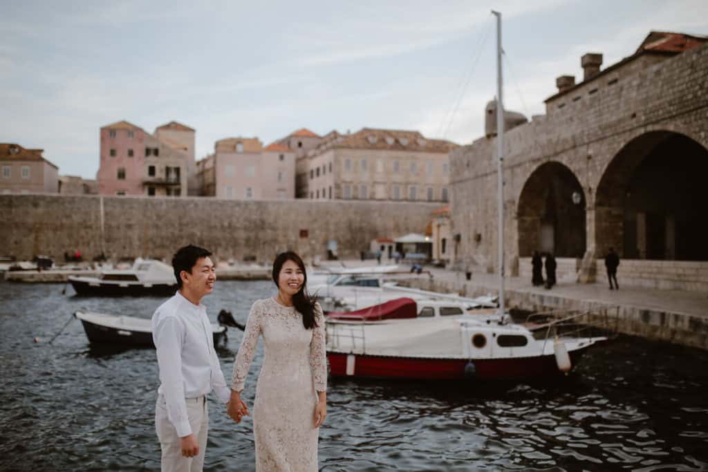 Dubrovnik for couples - a photo of a couple in old port in Dubrovnik.